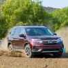 A burgundy 2019 Honda Pilot off-roading in dirt