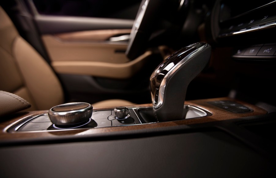 The wood and brown leather interior of a 2020 Cadillac CT5 sedan.