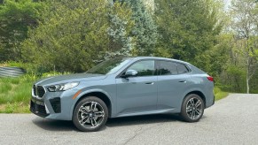 The 2024 BMW X2 parked near foliage