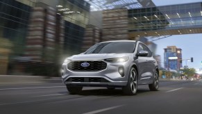 The 2024 Ford Escape Hybrid driving on the road