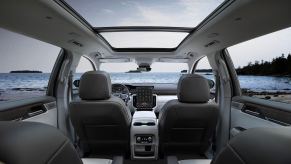 The leather interior of a 2024 GMC Acadia with a sunroof.