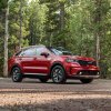 The 2024 Kia Sorento Hybrid off-roading in the woods