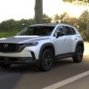 The 2024 Mazda CX-50 driving on the road