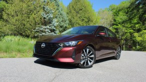 The 2024 Nissan Sentra parked near foliage