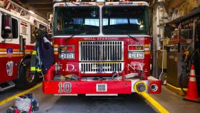 An FDNY fire truck, an engine, shows off its well-used equipment.