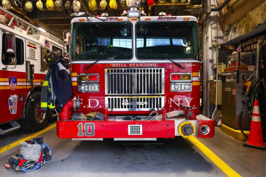 An FDNY fire truck, an engine, shows off its well-used equipment.