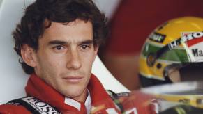 Formula 1 driver Ayrton Senna sits in his race car before a Grand Prix