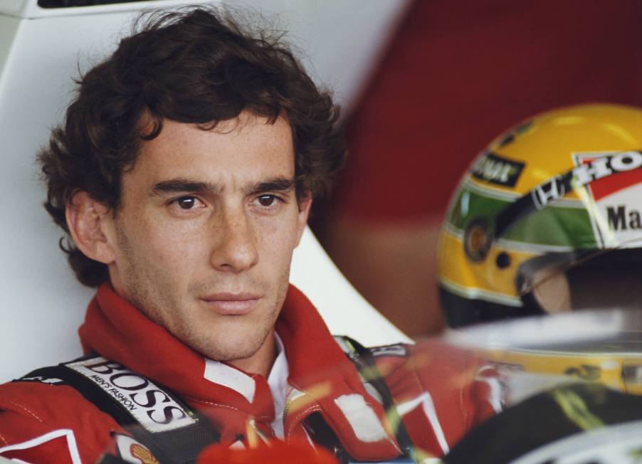 Formula 1 driver Ayrton Senna sits in his race car before a Grand Prix