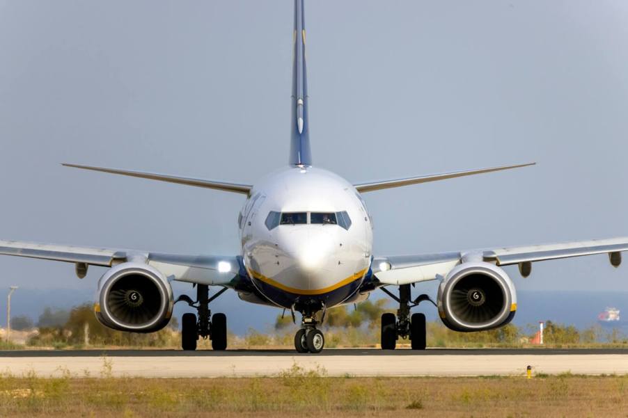 A Ryanair Boeing 737 sits on the tarmac awaiting takeoff.