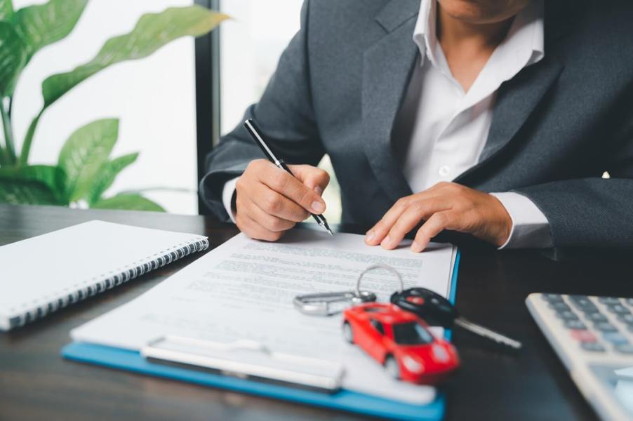 An insurance agent works on an act of God car insurance claim.