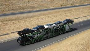 A car transporter charges a cost to ship a car, truck, or SUV across the country.