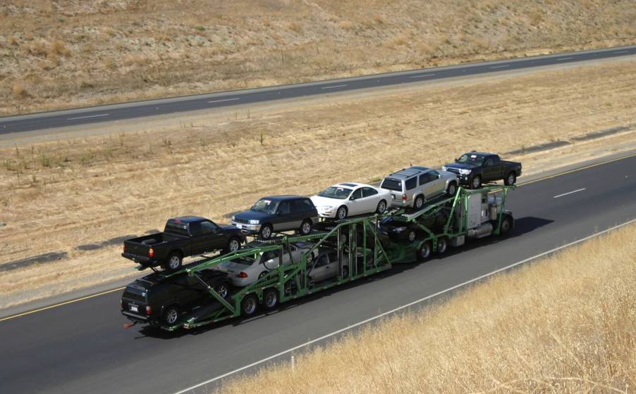 A car transporter charges a cost to ship a car, truck, or SUV across the country.