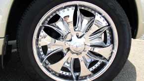 A custom car with chrome "spinner" or "floater" rims