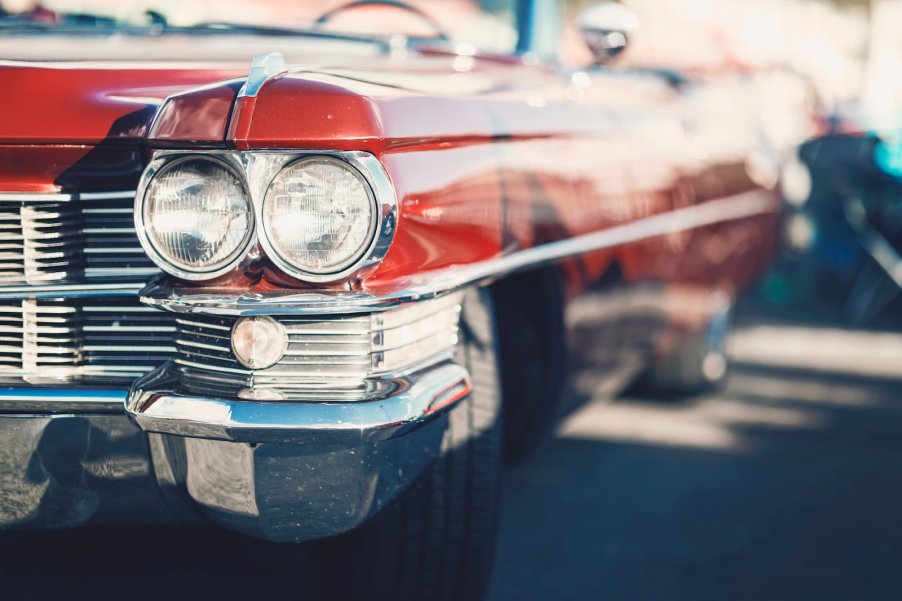 The headlights of a classic Cadillac lowrider car