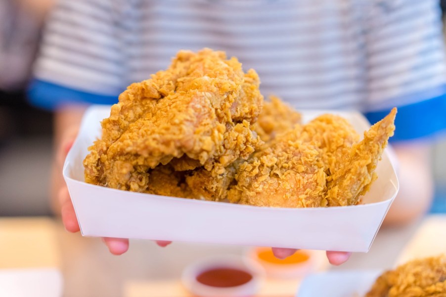 Paper box full of Royal Farms gas station fried chicken.