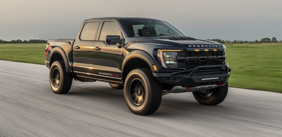 A black Hennessey VelociRaptoR 1000 drives on a test track as the company's latest 'Super Truck'.