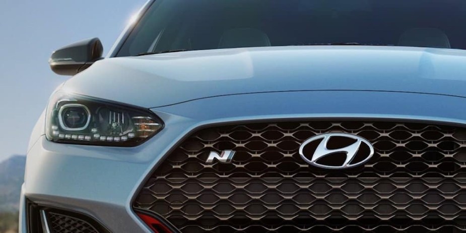 A blue Hyundai car with an "H" and an "N" logo on its grille