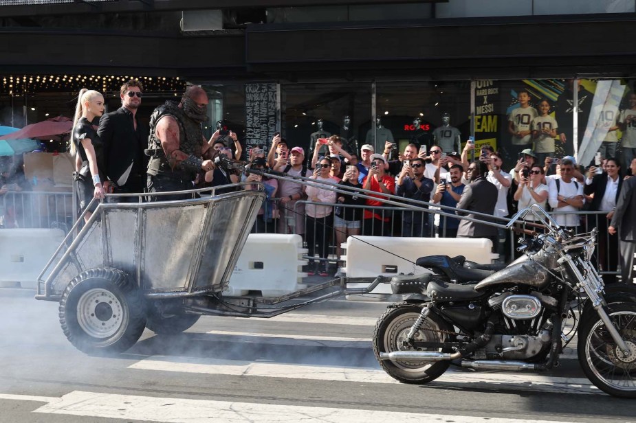 Chris Hemsworth and Ana Taylor-Joy ride to the Mad Max Furiosa premiere in Hollywood aboard a chariot pulled by motorcycles.