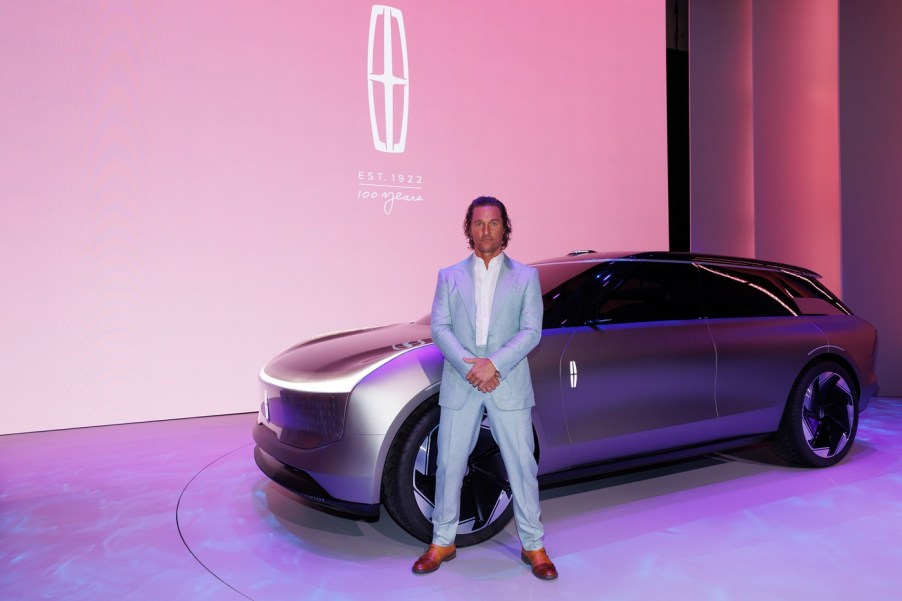 Matthew McConaughey posing near a Lincoln