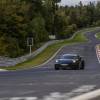 The black 992.2 Porsche 911 Hybrid on the Nürburgring Nordschleife.