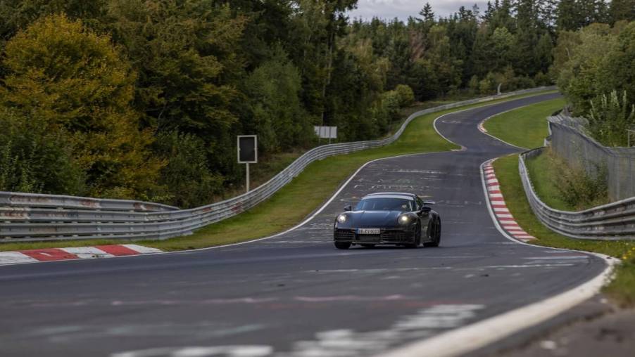 The black 992.2 Porsche 911 Hybrid on the Nürburgring Nordschleife.