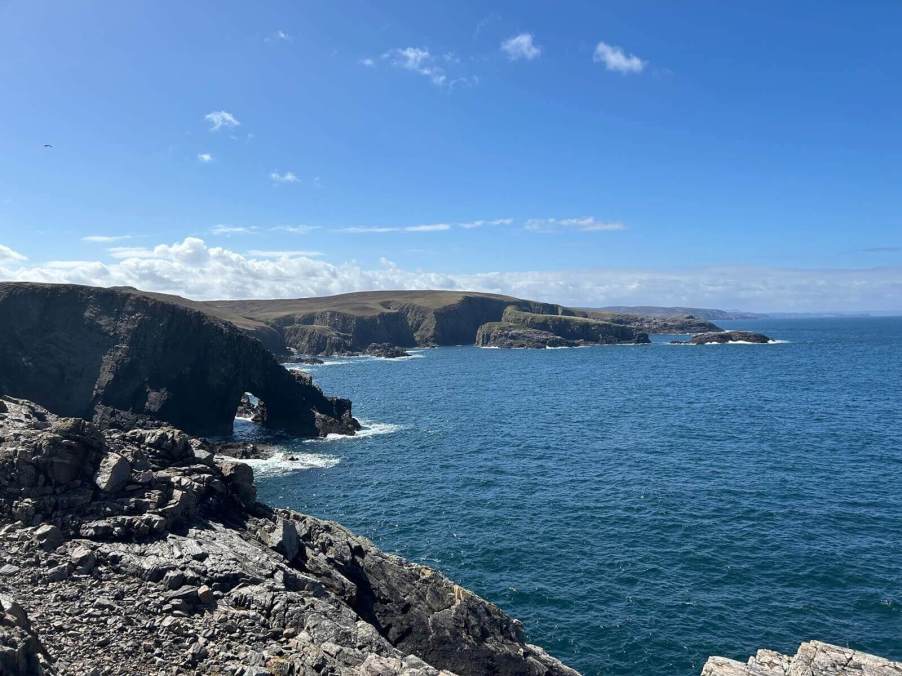 A vista off the road on the North Coast 500 is accessible by driving in Scotland.