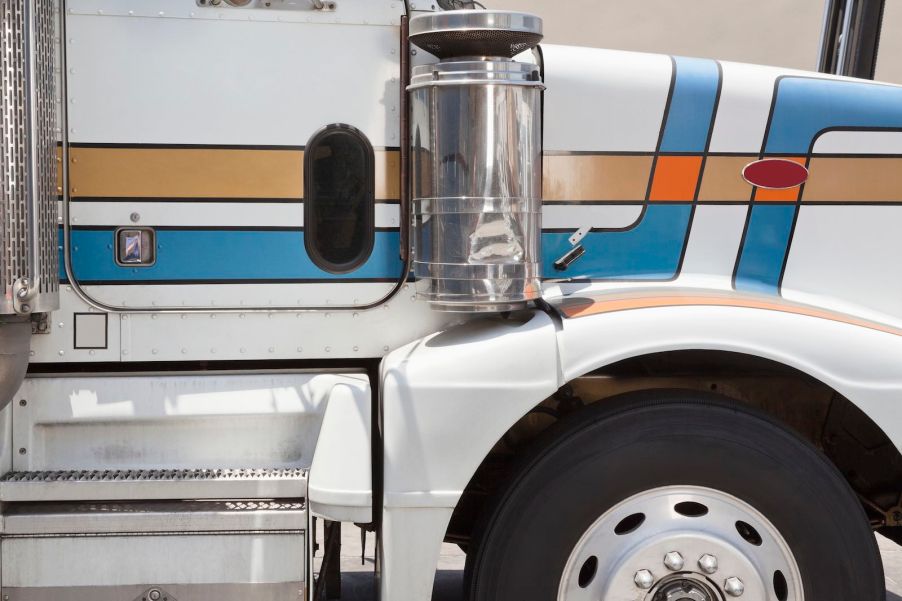 The blindspot door in the passenger side floor of a semi truck.