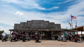 Row of Harley Davidsons parked in front of a saloon in Montana