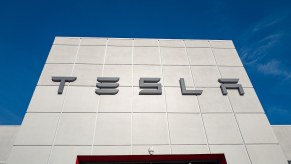 Tesla logo above the doors of a factory.