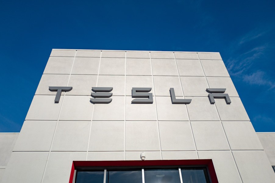 Tesla logo above the doors of a factory.