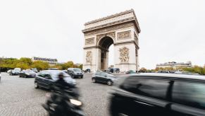 Traffic whizzing by the Arc de Triomphe in Paris