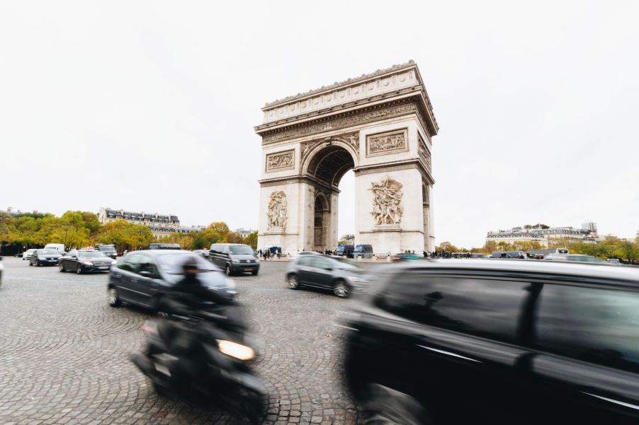 Traffic whizzing by the Arc de Triomphe in Paris