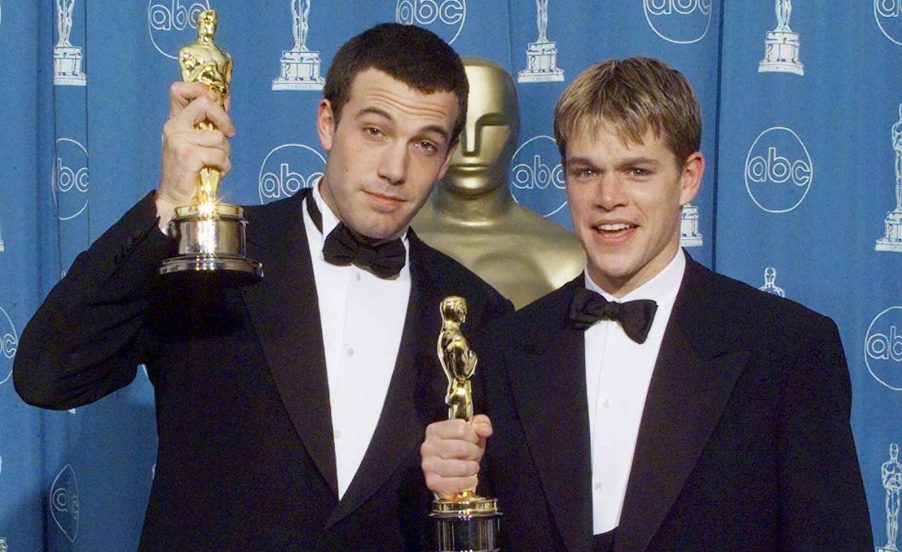 Ben Affleck and Mat Damon holding their Oscars after writing and starring in "Good Will Hunting" 1998