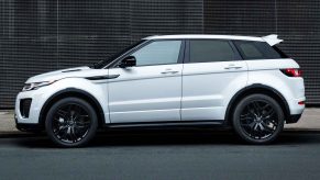 A white 2015 Range Rover Evoque parked in full left profile view