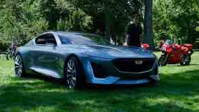 Front of a Cadillac Expressive concept coupe parked in a field at a car show