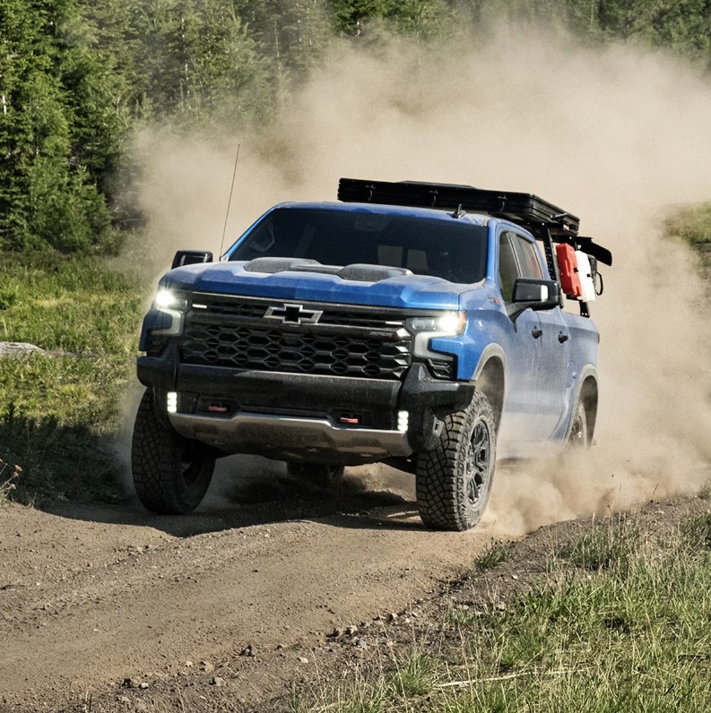 The 2024 Chevy Silverado overlanding on a dirt road