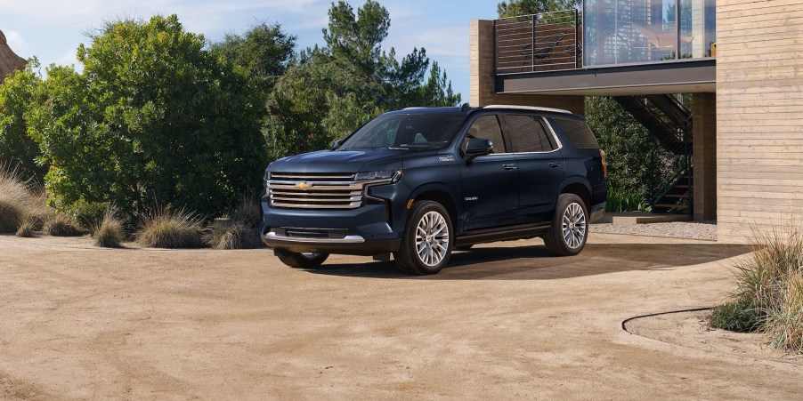 The 2024 Chevrolet Tahoe parked near a home