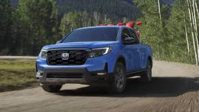 The 2024 Honda Ridgeline on a dirt road