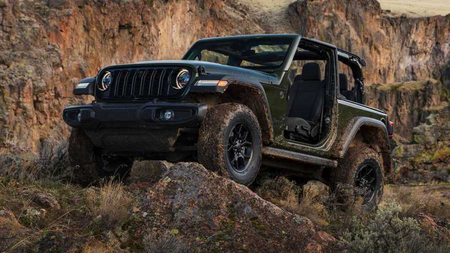 The 2024 jeep Wrangler climbing over rocks