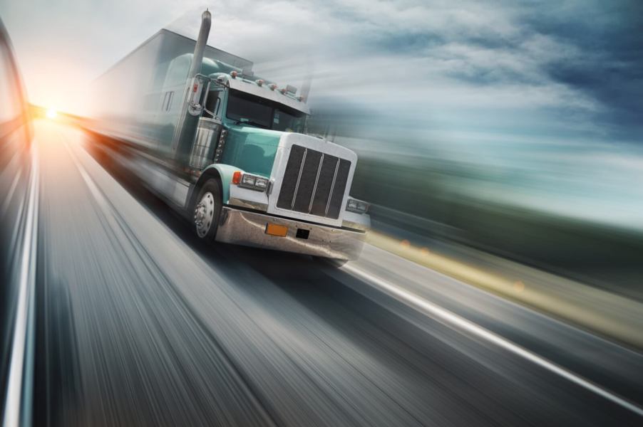 A trucker speeding in their semi-truck.