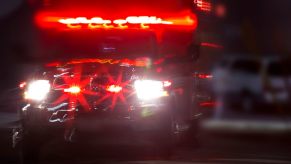 An EMT or paramedic uses lights and sirens while driving an ambulance.