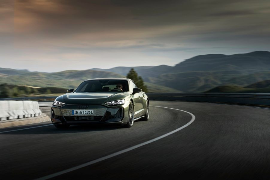 A 2025 Audi RS e-tron GT Performance takes a corner at speed.