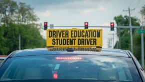 Car with a Student Driver sign on the roof