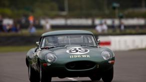 A 1963 Jaguar E-Type in British racing green at Goodwood.