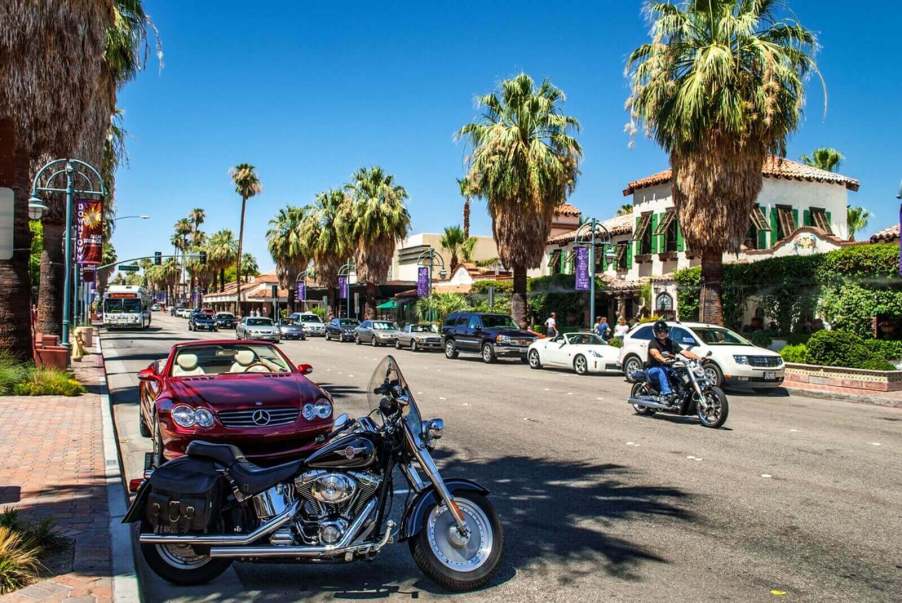 A motorcycle in a parking spot along the road in California.