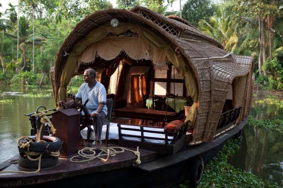 Houseboat on a river in the jungle in rural India.