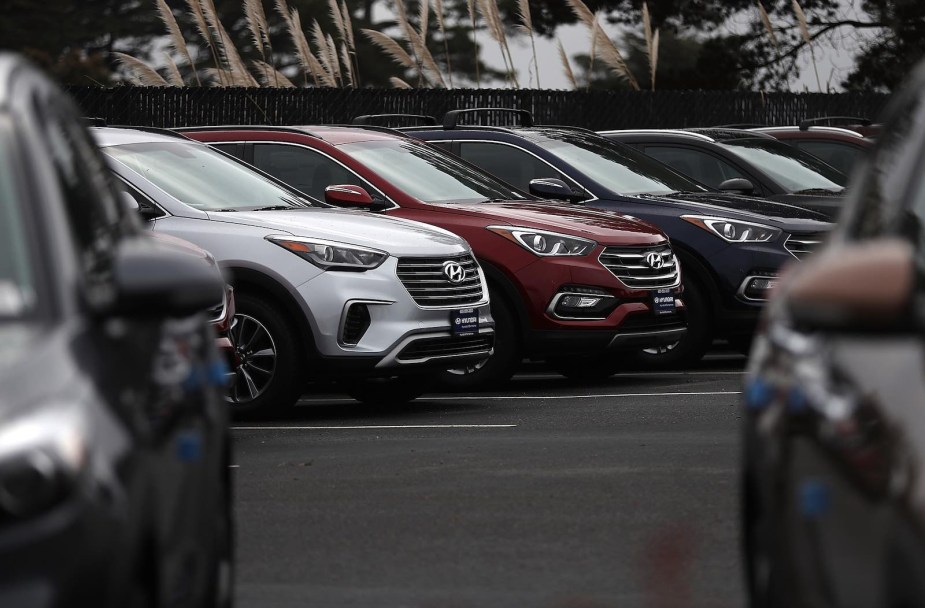 Row of new Hyundai cars at a dealership