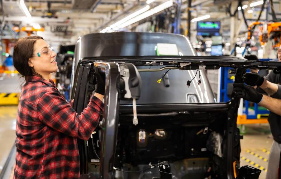 Factory worker in Toledo assembles a Jeep Gladiator pickup truck.