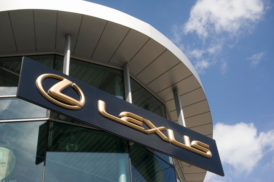 Golden Lexus sign above a dealership