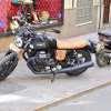 Moto Guzzi cafe racer parked on the sidewalk in Spain